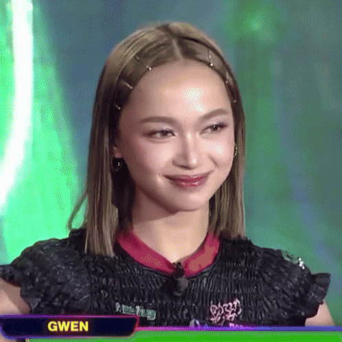 gwen is the name displayed on the screen behind the woman