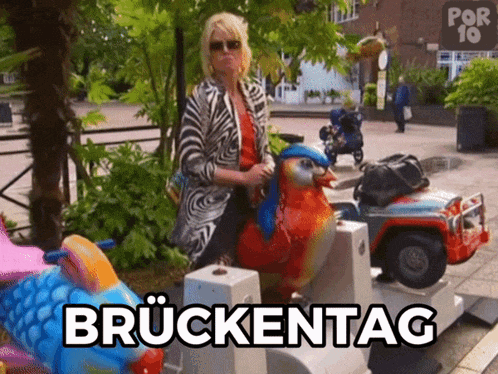 a woman is riding a ride that says bruckentag on it
