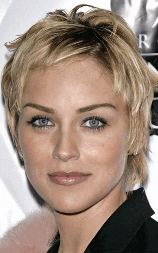 a close up of a woman 's face with the letter r in the corner