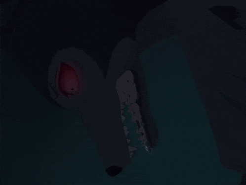 a close up of a wolf 's face with its mouth open in the dark
