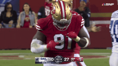 a football player wearing a red jersey with the number 91 on it