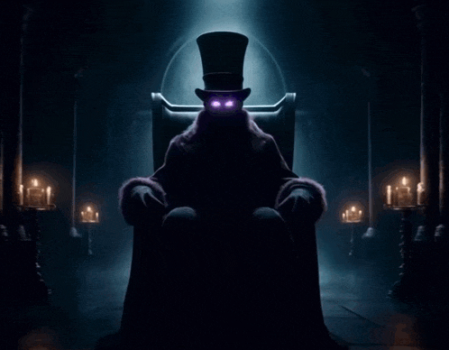 a man in a top hat is sitting in a chair with candles in the background