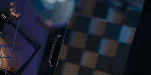 a woman in a lab coat and glasses is looking at something