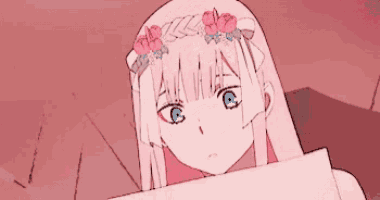 a girl with long pink hair and blue eyes is holding a piece of paper .