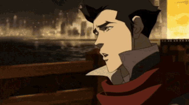 a man with a red scarf around his neck is looking at something