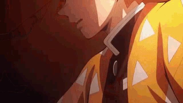 a close up of a person wearing a yellow jacket with triangles on it and a black tie .