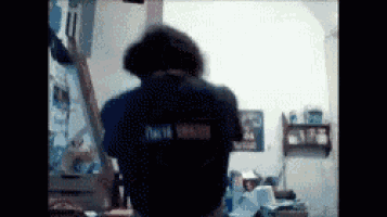a person wearing a shirt that says tokyo smash on it