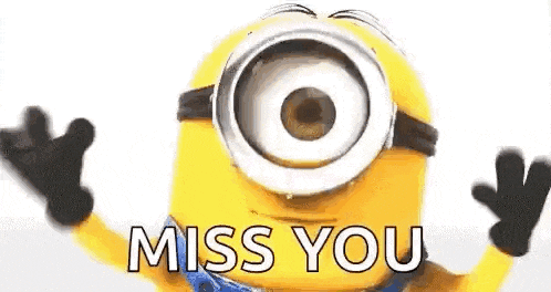 a minion with a big eye is waving his hands and saying `` miss you '' .
