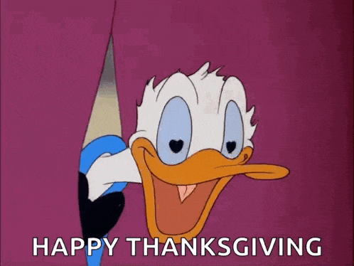 a cartoon of donald duck peeking out from behind a curtain and saying happy thanksgiving .