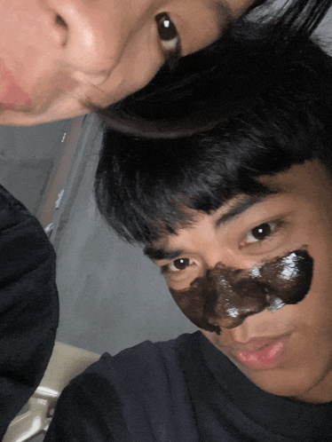 a man has a black mask on his face