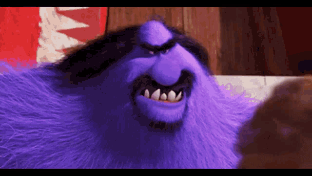 a close up of a purple furry monster with a beard and teeth