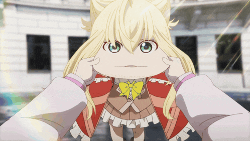 a little girl with blonde hair and a yellow bow on her head
