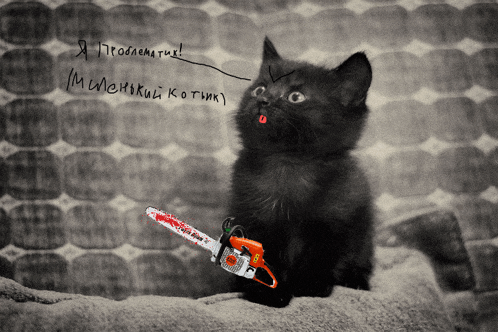 a black cat is holding a bloody chainsaw and says i 'm a monster