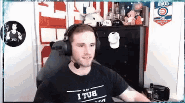 a man wearing headphones and a t-shirt that says ' i tub ' on it
