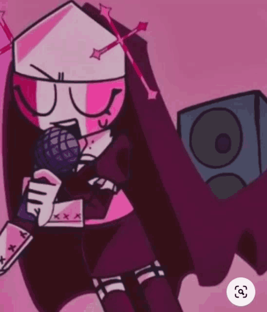 a nun is singing into a microphone while holding a speaker .