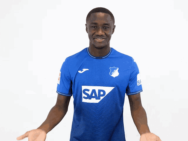 a man wearing a blue shirt with the word sap on the front