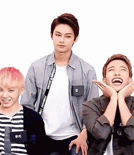 a group of young men are posing for a picture and one of them has a name tag that says ' i love '
