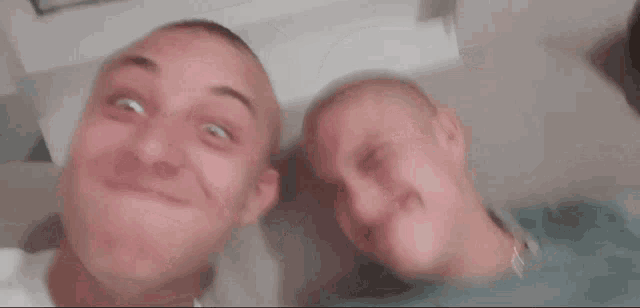 two men are making funny faces with one sticking out his tongue