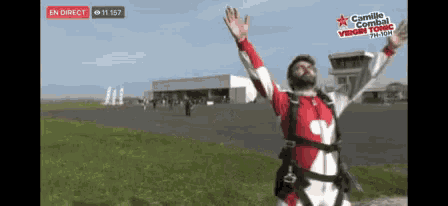 a man in a red and white suit is standing in front of a sign that says camille combat virgin tonic on it