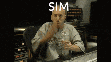 a man is sitting at a desk with the word sim on the screen