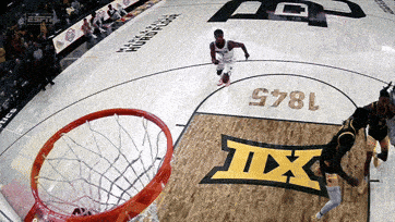 a basketball game is being played on a court that says tx on it