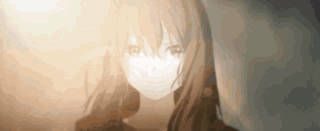 a close up of a girl 's face with the sun shining on it .