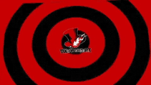 joker from persona 5 has a clown mask on his face and red eyes .