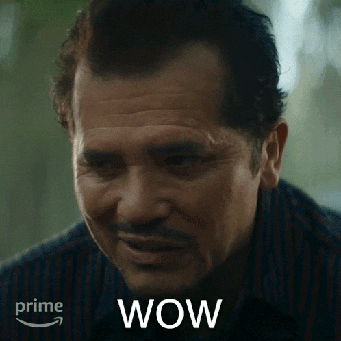 a close up of a man 's face with the word wow on the bottom right