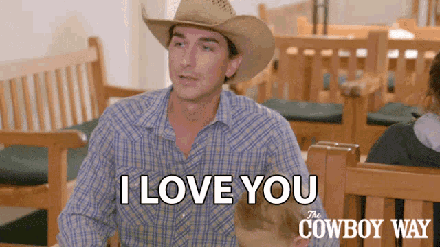 a man in a cowboy hat is saying i love you