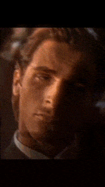 a close up of a man 's face with the words badham on the bottom left