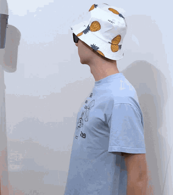 a man wearing a hat and sunglasses has a shirt that says sre neu-ulm 2019