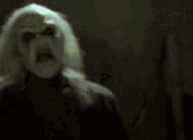 a close up of a ghost with red eyes and white hair