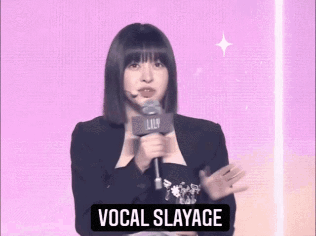 a woman singing into a microphone with the words vocal slayage above her