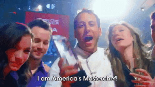 a group of people are standing around a man who says i am america 's master chef