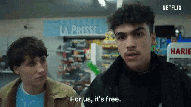two men are standing in front of a sign that says " la presse "