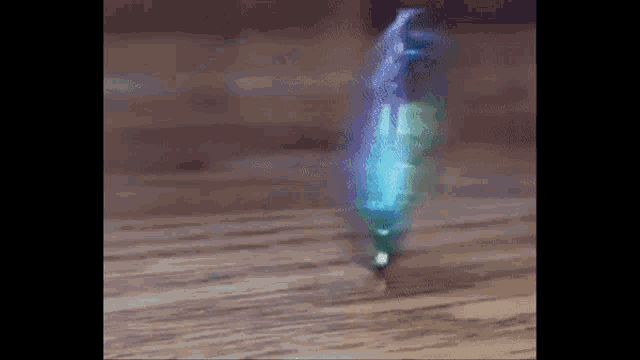 a close up of a spinning top on a wooden table