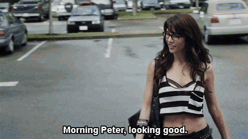 a woman walking down a street with the words morning peter looking good above her