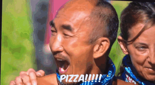 a man with his mouth open and the word pizza written on his face
