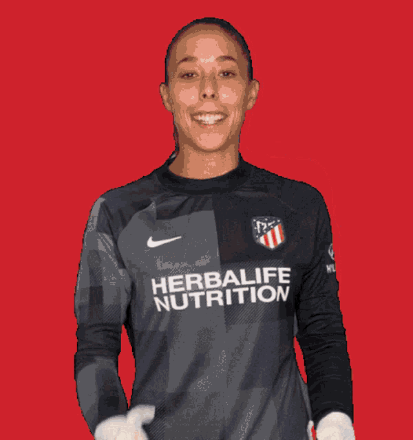 a woman wearing a jersey that says life on