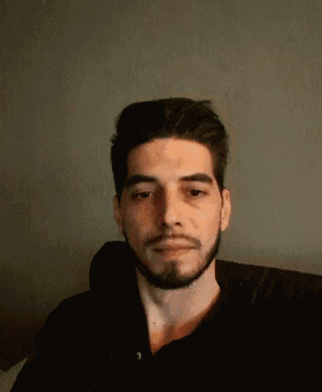 a man with a beard is wearing a black shirt with the number 3 on it