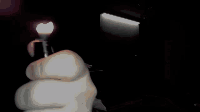 a man wearing headphones in a dark room