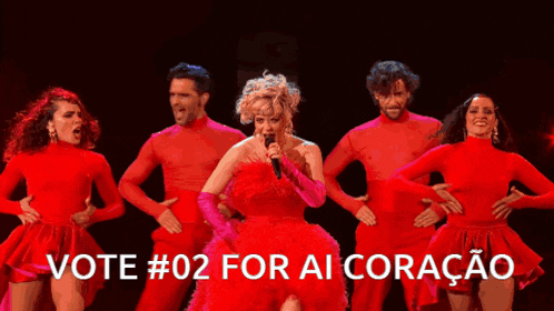 a woman in a red dress singing into a microphone with the words vote # 02 for ai coracao