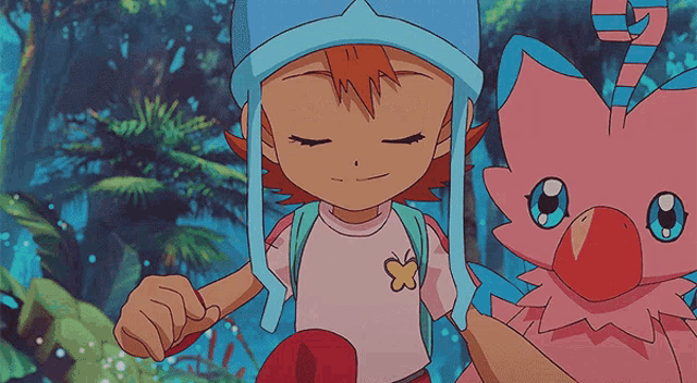 a girl in a blue hat is standing next to a pink animal