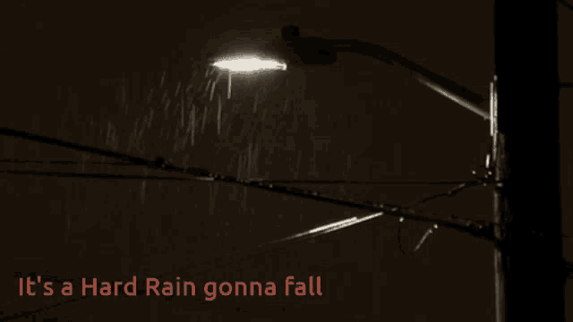 a sign that says " it 's a hard rain gonna fall " on it