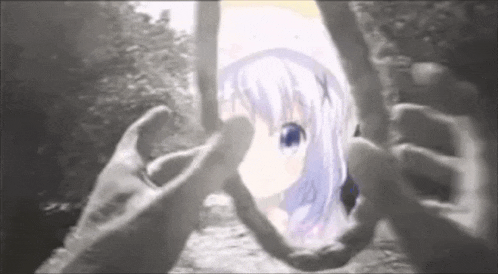 a black and white photo of a person holding a picture of a girl with purple hair .