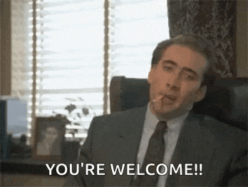 a man in a suit and tie is smoking a cigarette and says `` you 're welcome ! ''