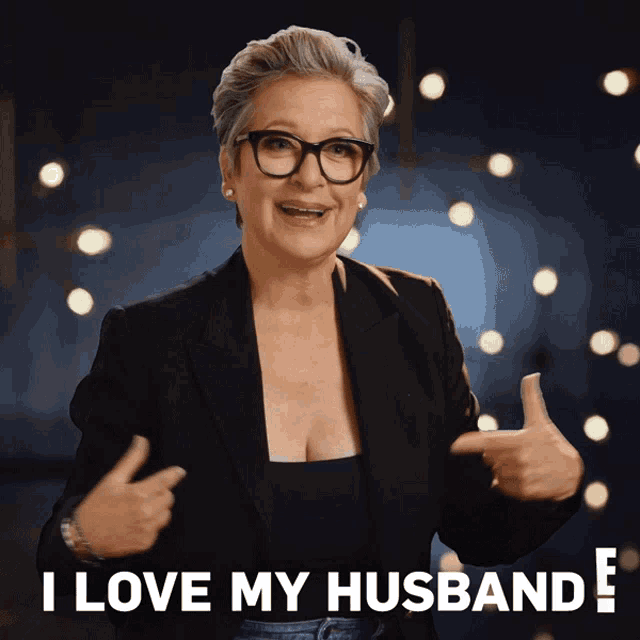a woman giving a thumbs up with the words i love my husband