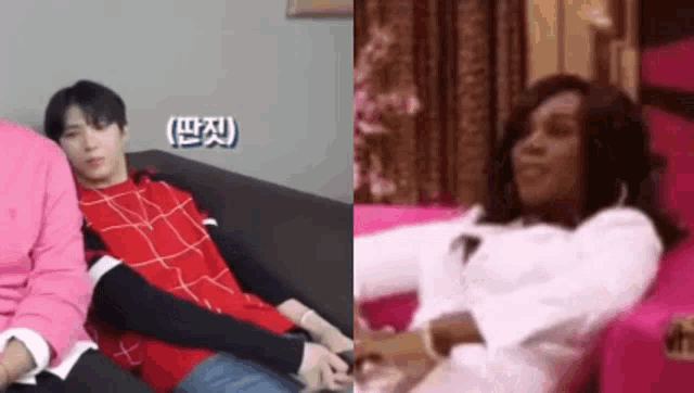 a man in a red shirt is laying on a couch next to a woman in a white shirt .
