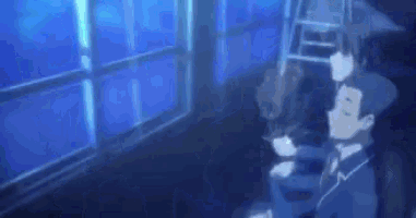 a blurry picture of a person standing in front of a window with a blue light coming out of it .