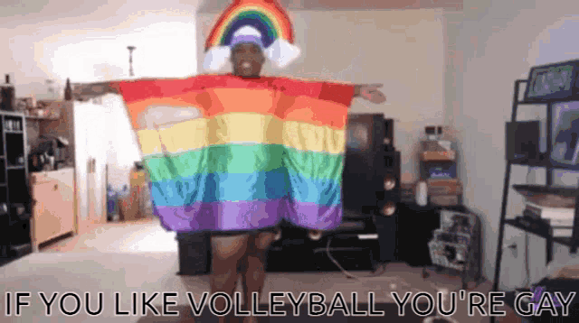 a person wearing a rainbow colored cape with the words if you like volleyball you 're gay